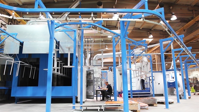 Powder coating of metal parts on industrial production line